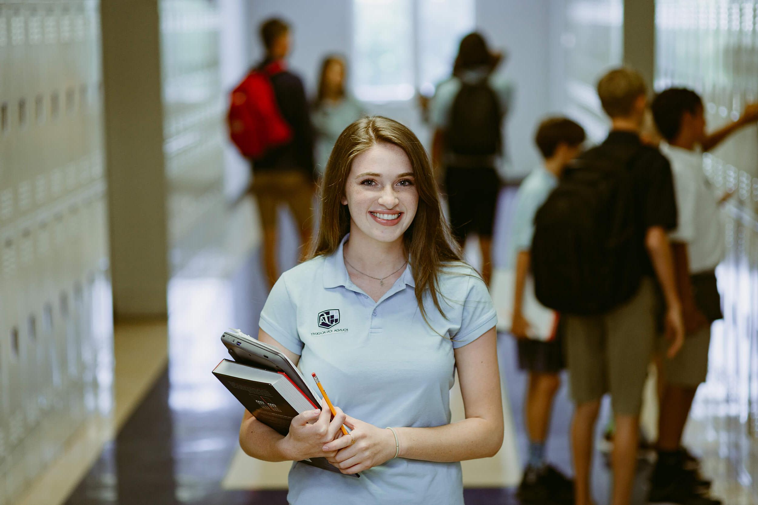 Student at Foundation Academy in school hallway